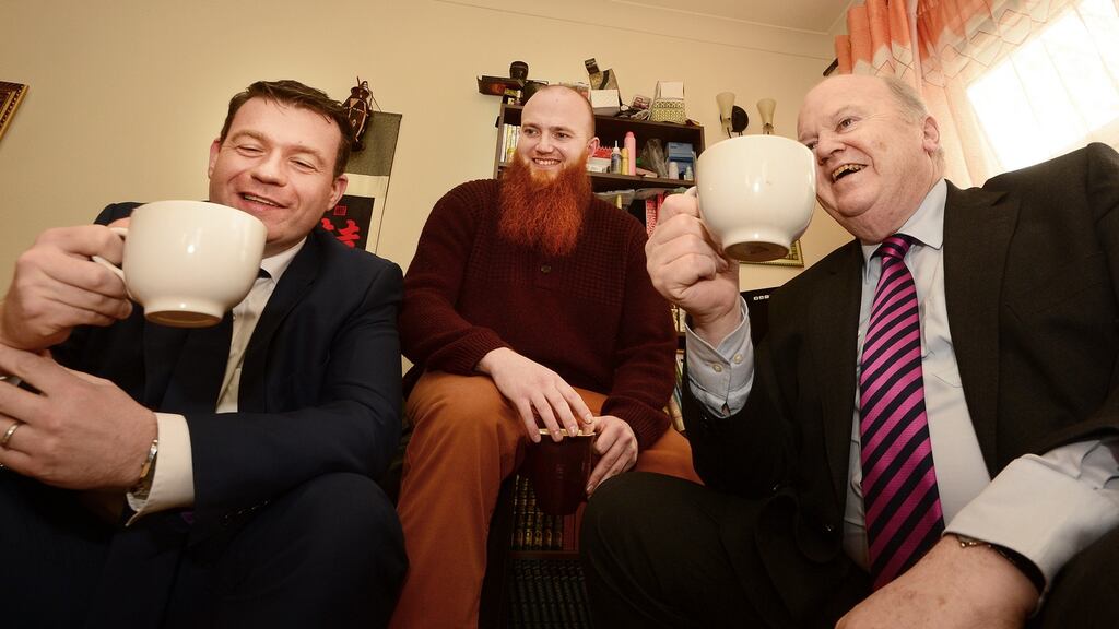 “A lot to welcome”. Minister Alan Kelly, and Minister Micheal Noonan take tea with tenant Eoin Whelan after announcing rental reforms.Photograph: Cyril Byrne / THE IRISH TIMES