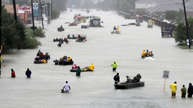 Rescue boats fill a flooded street in Houston, Texas on Monday. Photograph: David J Phillip/AP