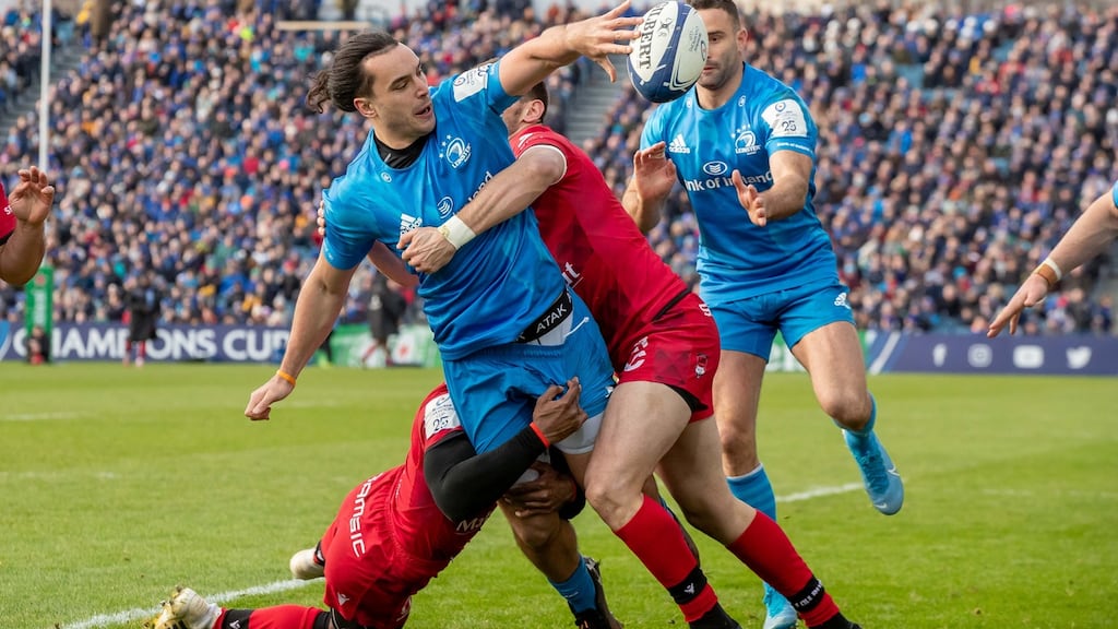 Leinster’s James Lowe offloads as he is tackled by Lyon’s Noa Nakaitaci and Xavier Mignot during the Heineken Champions Cup at the RDS. Photograph: Morgan Treacy/Inpho