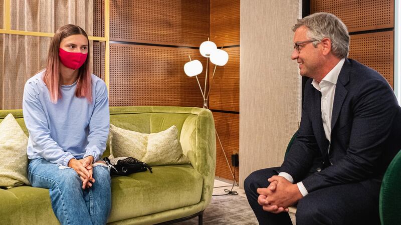 Belarusian athlete Krystsina Tsimanouskaya with Austrian state secretary Magnus Brunner during a stopover in Vienna on Wednesday. Photograph: Florian Schroetter/EPA