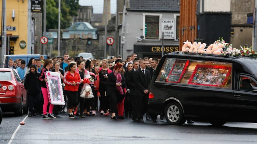 Mourners follow the hearse as it takes Chloe Kinsella’s remains to St Munchin’s Church in Limerick. Photograph: Brian Gavin/Press 22
