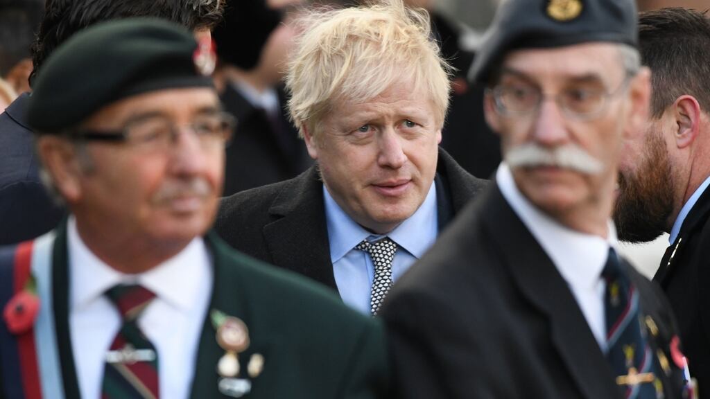British prime minister Boris Johnson during a service at the cenotaph in St Peter’s Square, Wolverhampton, to mark Armistice Day. Photograph: Stefan Rousseau/PA