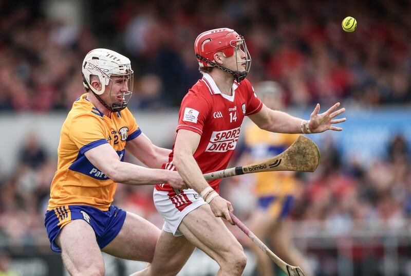 Cork's Alan Connolly is challenged by Adam Hogan of Clare in the first round of the Munster hurling championship. Photograph: Tom Maher/Inpho