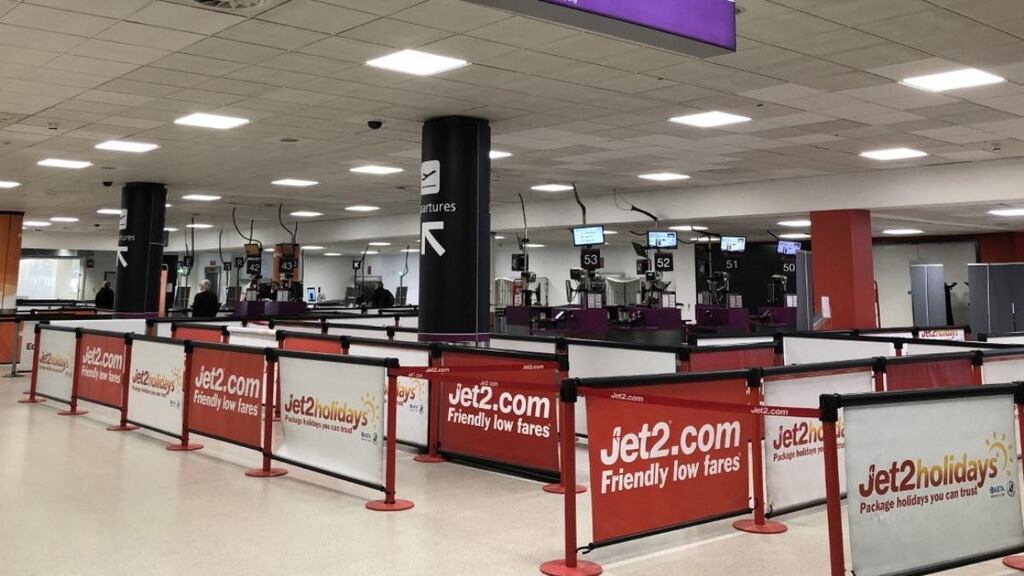 Empty check-in lines at a Jet2 check in desk at Edinburgh Airport. Photograph: Andrew Milligan/PA Wire
