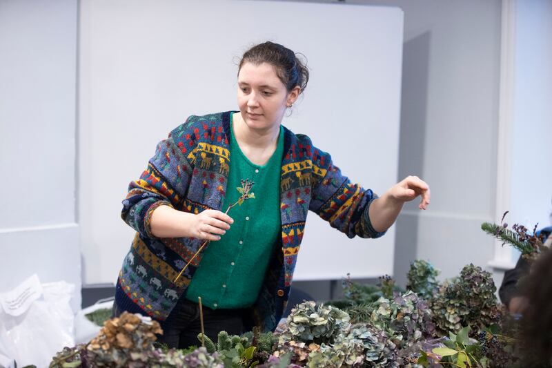 Abigail Flynn, psycho-social officer with Spirasi, participates in the wreath-making workshop. Photograph: Tom Honan