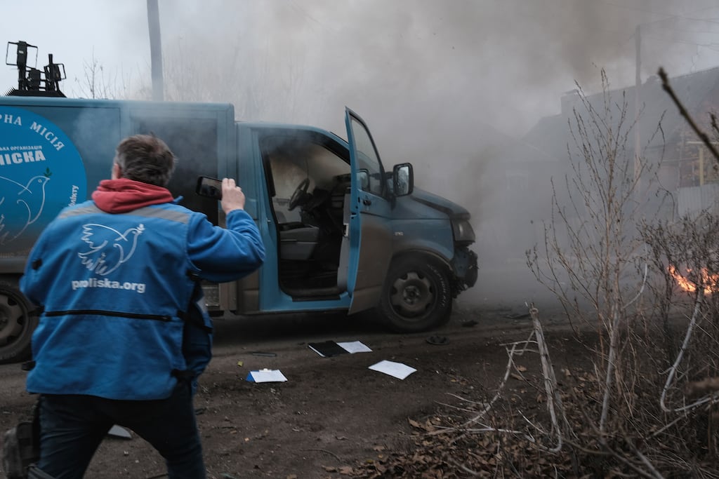 Team members of a humanitarian mission react at the site shortly after their vehicle was struck by a Russian drone in the frontline city of Kostyantynivka, Donetsk region, eastern Ukraine, on Saturday. Photograph: EPA