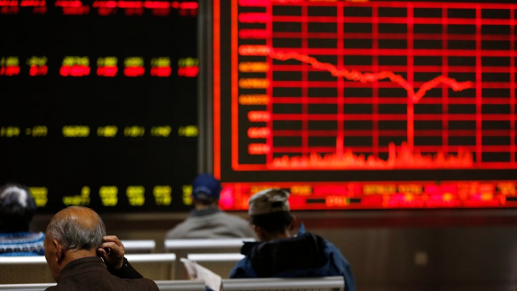 Chinese investors in Beijing: Asian shares have rallied in a remarkable snapback from the shock of Donald Trump’s presidential victory. Photograph: How Hwee Young/EPA