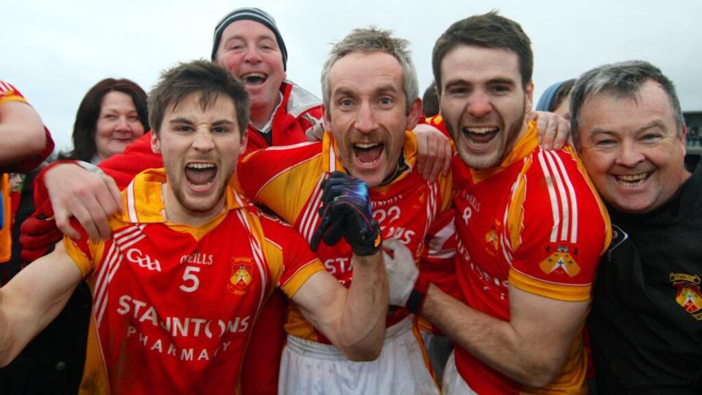 Castlebar Mitchels capatin Donal Newcombe, Kevin Filan and Gerard McDonagh celebrate their provincial final victory. Photograph: Mike Shaughnessy/Inpho
