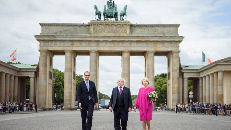 Berlin’s mayor, Michael Mueller, with President Michael D Higgins and Sabina Higgins during a visit to Brandenburg Gate. Photograph: Gregor Fischer