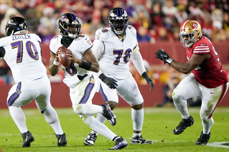 Lamar Jackson of the Baltimore Ravens evades the tackles at Levi's Stadium on Christmas Day. Photograph: Thearon W. Henderson/Getty Images