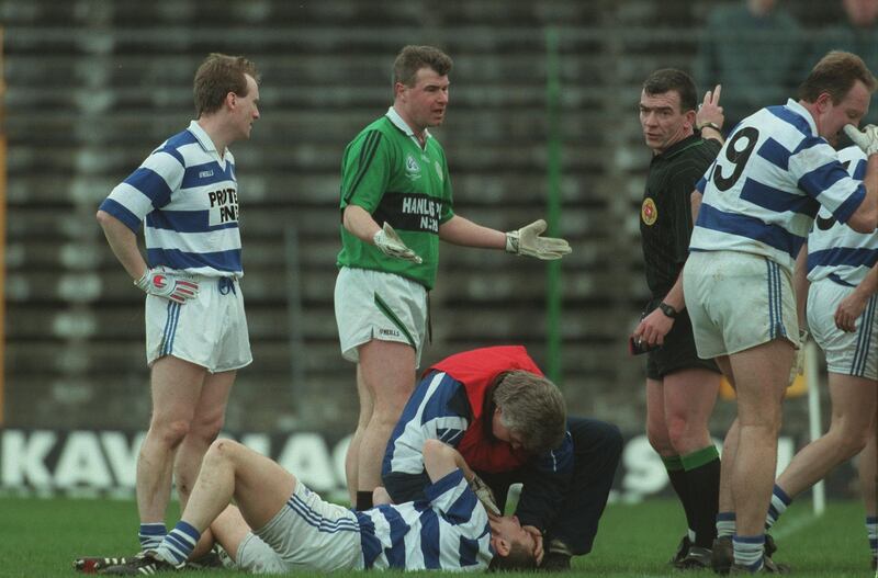 Former Dublin star Charlie Redmond (Erin's Isle) is sent off by referee Pat McEnaney after an incident involving Castlehaven's Brian Collins in the 1998 All-Ireland club semi-final. Photograph: Patrick Bolger/Inpho