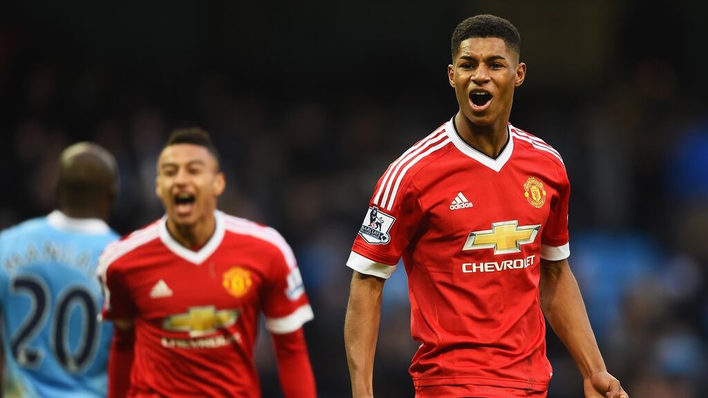 Jesse Lingard (L) says Manchester United’s derby winner Marcus Rashford remains grounded. Photograph: Getty