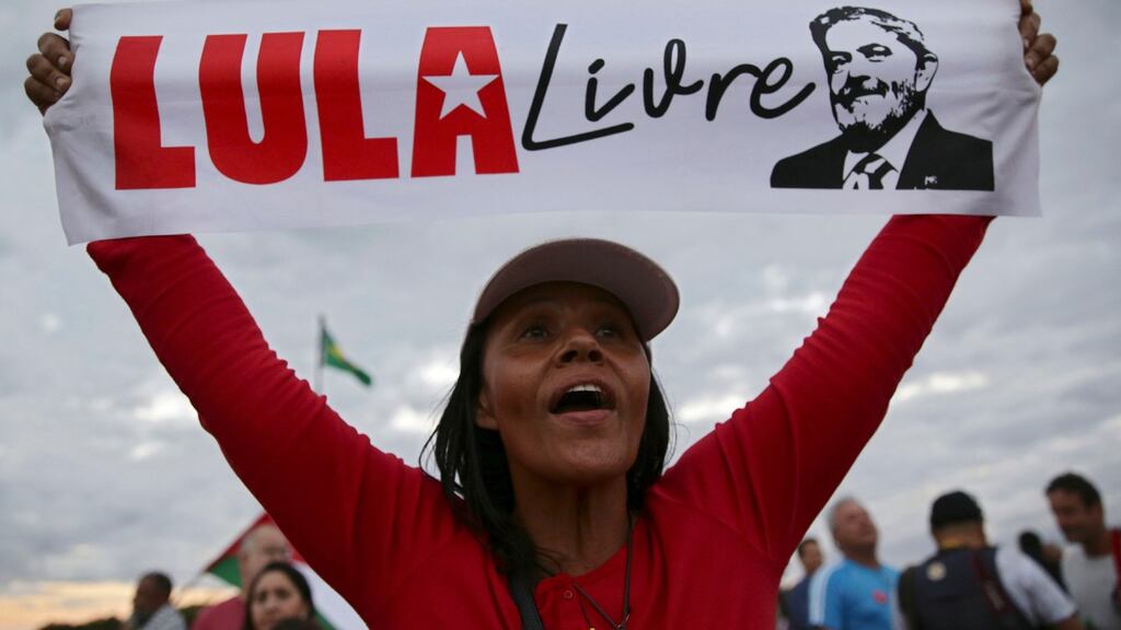 A supporter of Luiz Inacio Lula da Silva: the former president denies all the charges against him and claims he is the victim of a judicial witch-hunt. Photograph: AP Photo/Eraldo Peres