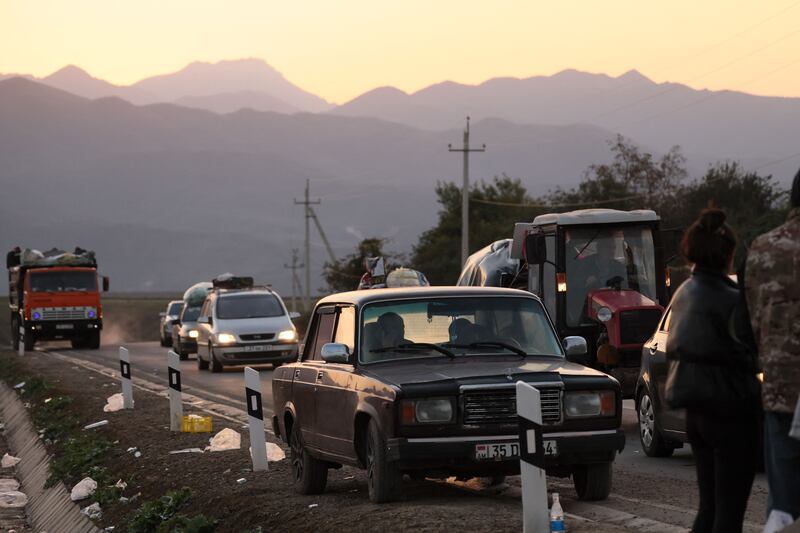 Refugees drive on after crossing the border near Kornidzor on September 28th. More than 65,000 Armenians have fled Nagorno-Karabakh for Armenia, Yerevan claims. Photograph: Alain Jocard/AFP