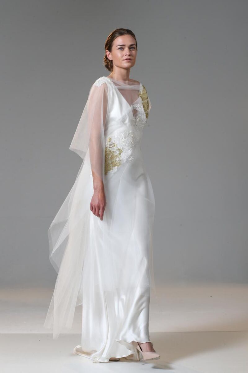 Low-back bias-cut dress in light ivory silk satin (€2,450), with applique lace tulle tunic (€1,250), by Delphine Grandjouan
