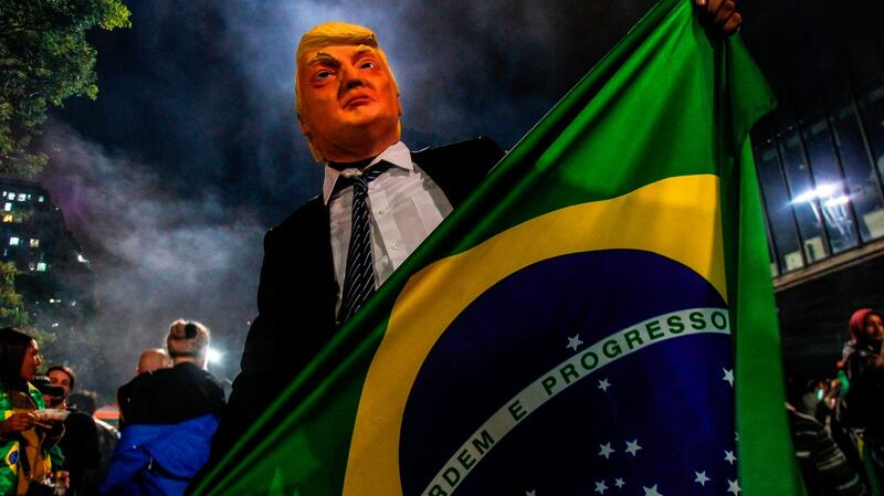 A supporter of Jair Bolsonaro celebrates in Sao Paulo. Photograph: Getty Images