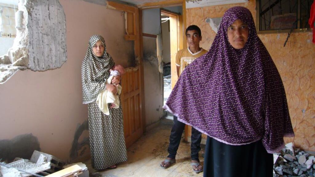 Sa’ed, Safa (with baby Abdallah) and Naima are among 10 people living in a badly damaged house in Shejaia. Photograph: Lara Marlowe
