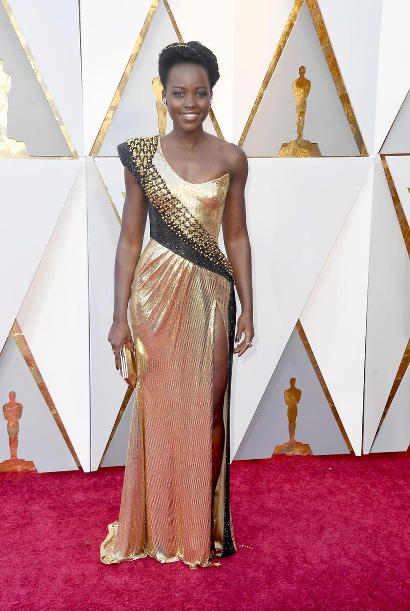 Lupita Nyong’o was resplendent in a liquid gold one-shoulder gown