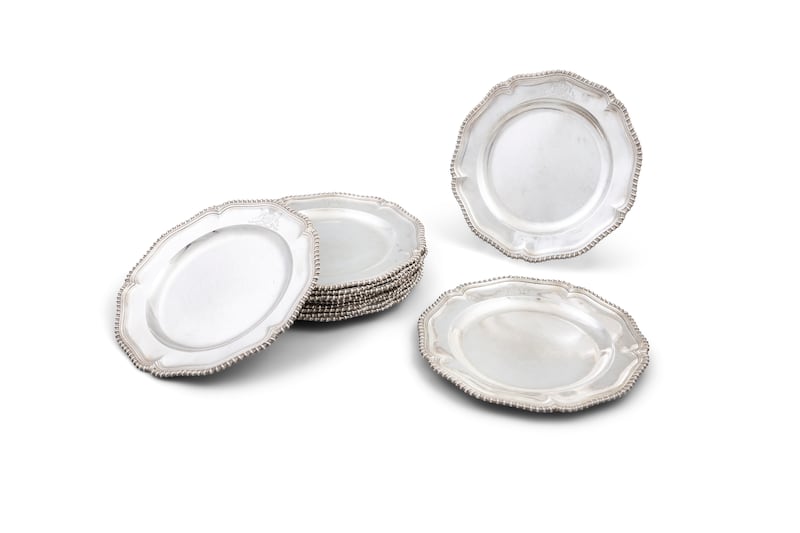 Twelve George II silver dinner plates made by Robert Calderwood for Drogheda House in Dublin
