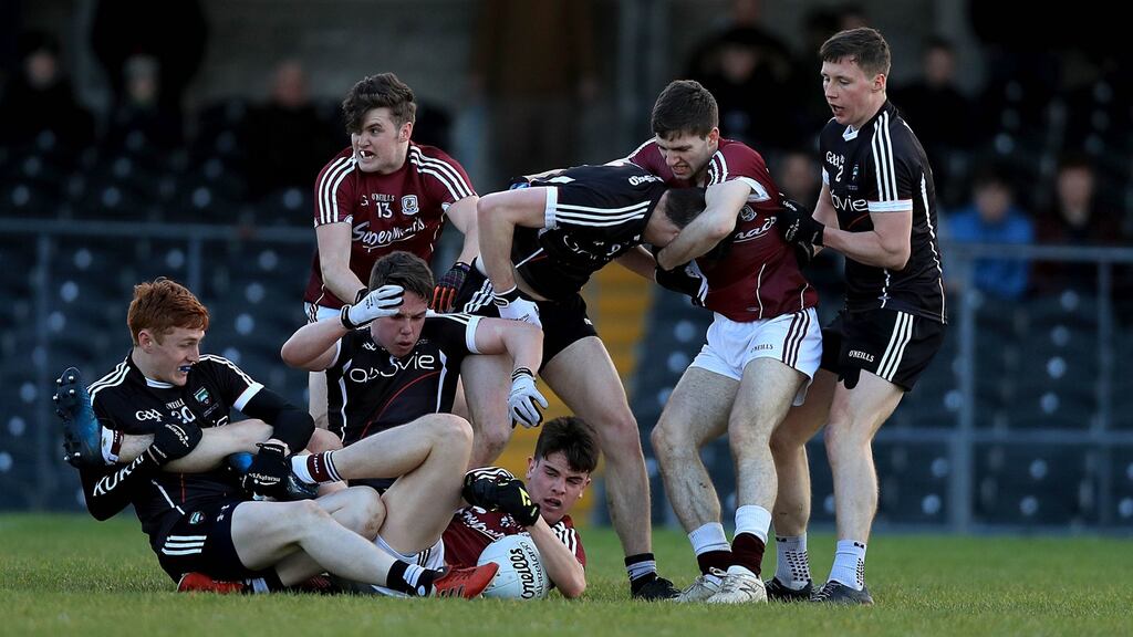 Sligo and Galway players tangle during their EirGrid Connacht GAA Under 21 Football Championship Final at Markievicz Park. Photo: Donall Farmer/Inpho