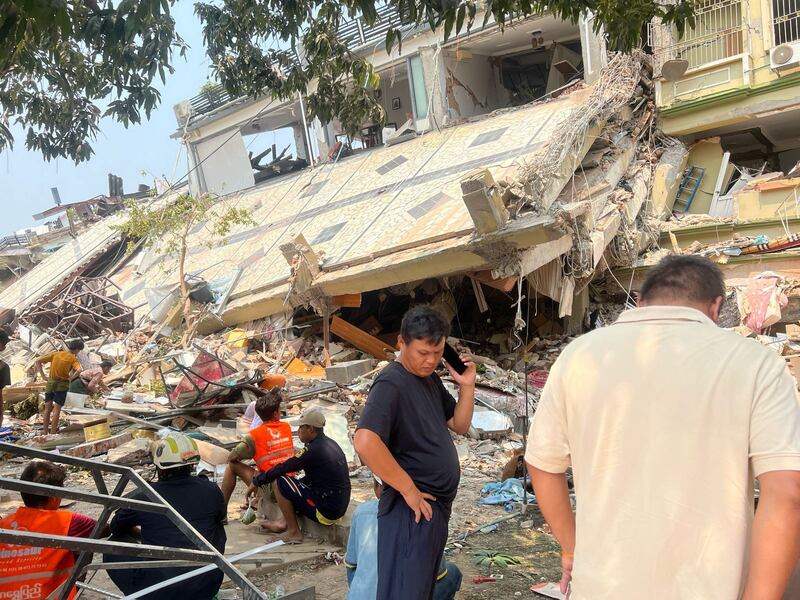 A search and rescue crew works at the site of a building destroyed in the 7.7-magnitude earthquake that struck near Mandalay. Photograph: The New York Times
