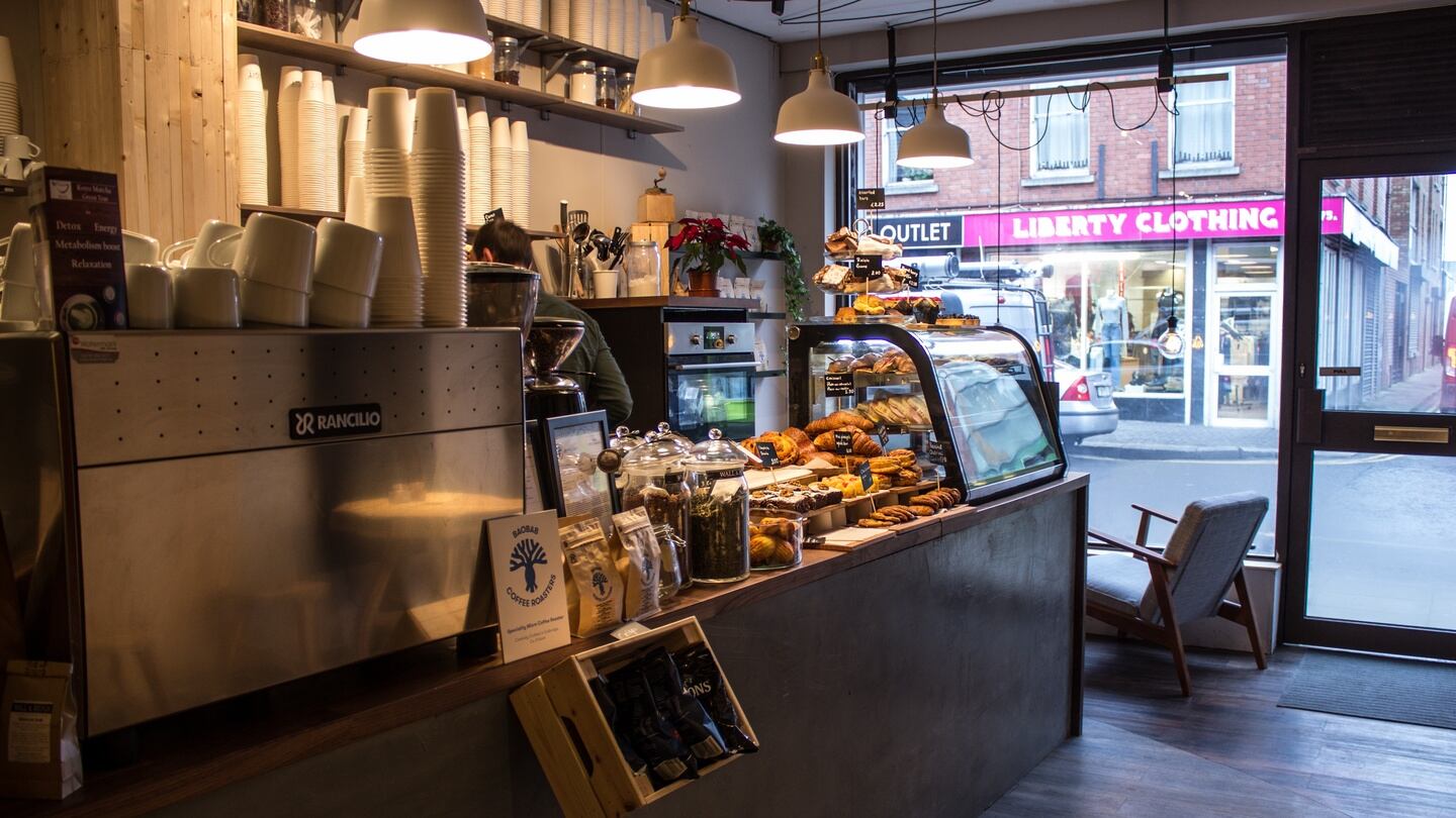 Legit cafe: The central counter with a walnut top has a polished concrete base in military green