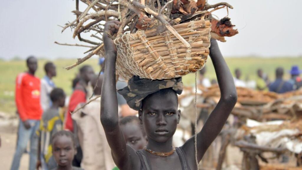 ‘In the miserable camps for the displaced, I have met the mothers of young children who have lost their fathers and older brothers, some of them victims of the conflict, many others fleeing the militia forces that are making South Sudan ungovernable.’ Above, an internally displaced girl carries firewood in Ganyiel village of Panyijar County of Unity State on March 21st. Photograph: SAMIR BOLSAMIR BOL/AFP/Getty Images