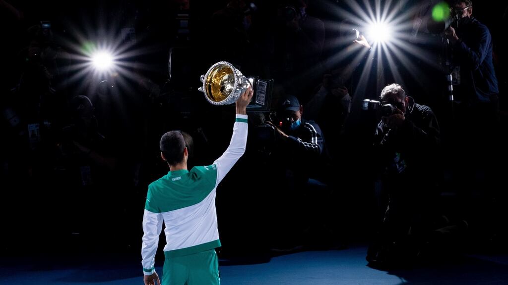 Novak Djokovic holds the Norman Brookes Challenge Cup as he celebrates victory in his men’s singles final against Daniil Medvedev at the Australian Open. Photo: Mackenzie Sweetnam/Getty Images