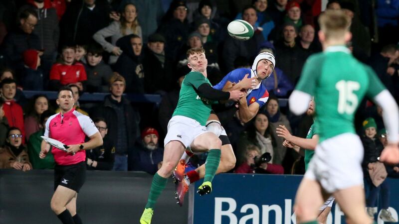 Ireland’s wing Jonathan Wren challenges France’s Vincent Pinto. Photograph: Paul Faith/AFP/Getty
