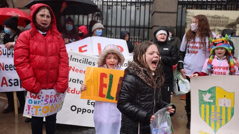 Parents, pupils and staff from St Colmcille’s National School, Co Louth, protesting outside Leinster House, Dublin.