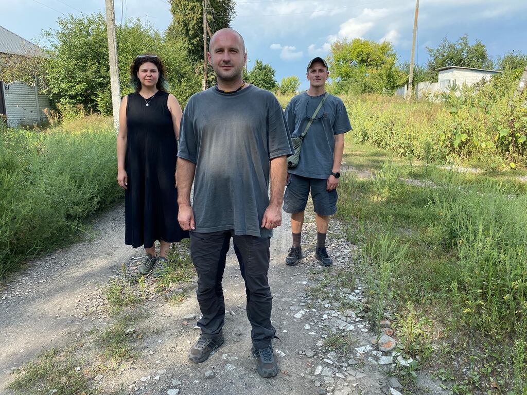 Ukrainians Kseniia Kalmus, Vlad Sharapa and Ihor Okuniev build a new roof each day in villages between Kharkiv and Russia. Photograph: Lara Marlowe
