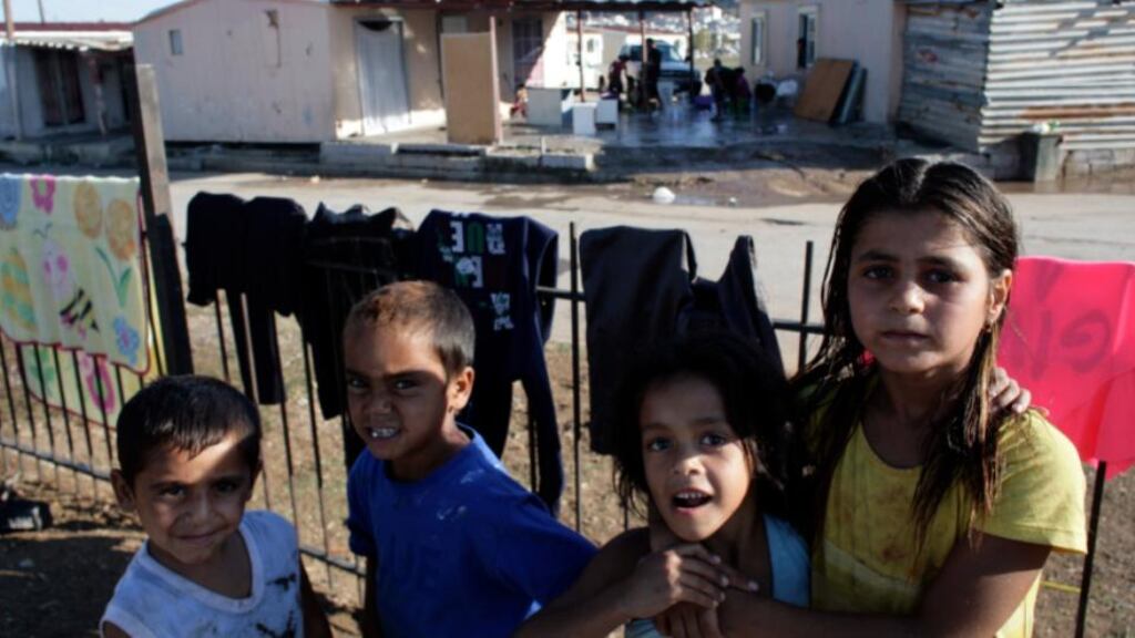 Children from a Roma community pose for photos at a Roma settlement north of the Greek capital Athens. Photograph: Milos Bicanski/Getty Images