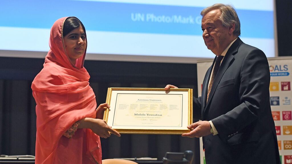 United Nations secretary-general Antonio Guterres presents a certificate to Nobel Peace Prize winner Malala Yousafzai, who has been  designated  UN Messenger of Peace with a special focus on girls’ education. Photograph: Jewel Samad/AFP/Getty Images