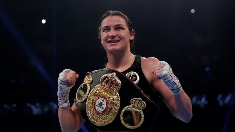 Katie Taylor celebrates with the belt at the end of the fight. Photograph: Andrew Couldridge/Reuters