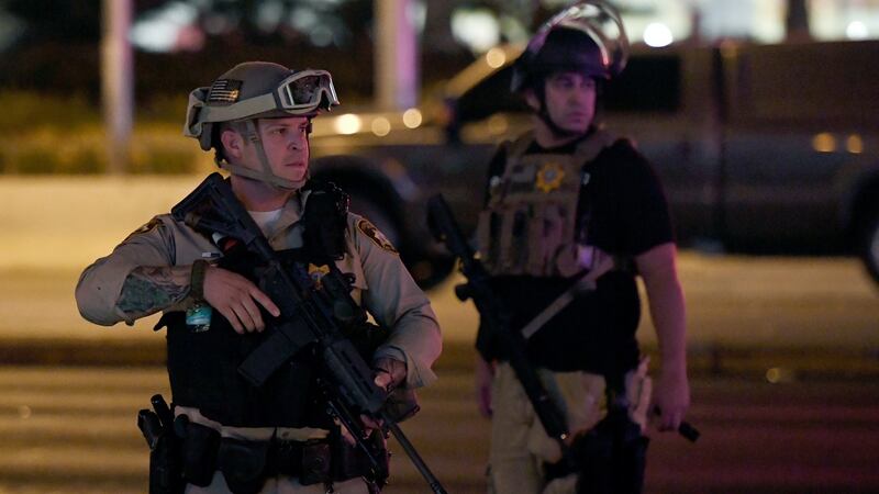 Las Vegas Metropolitan Police officers patrol Tropicana Avenue near Las Vegas Boulevard following the mass shooting. Photograph: Ethan Miller/Getty Images