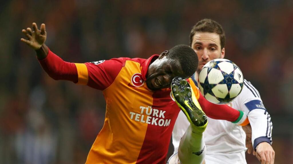 Galatasaray's Emmanuel Eboue is challenged by Real Madrid's Raphael Varane in Istanbul. Photograph: Murad Sezer/Reuters