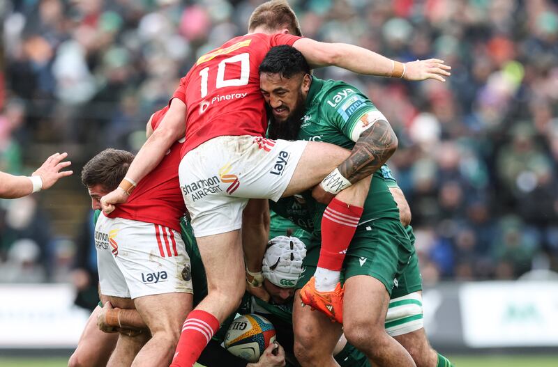 Connacht’s Bundee Aki tackles Munster outhalf Jack Crowley. Photograph: Billy Stickland/Inpho