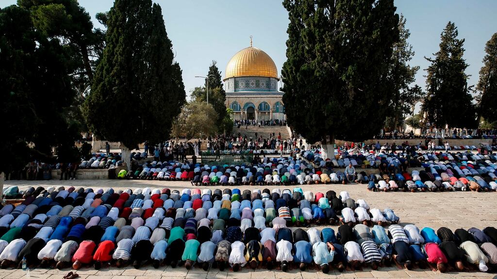 Palestinian Muslims bow in prayer inside the Haram al-Sharif compound, known to Jews as the Temple Mount, in the old city of Jerusalem, with the Dome of the Rock in the background. File photograph: Ahmad Gharabli/AFP/Getty Images