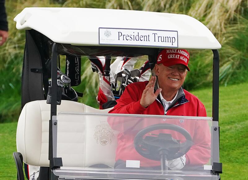 Former US president Donald Trump makes his way to the 4th tee at Trump International Golf Links & Hotel in Doonbeg, Co Clare on Thursday. Photograph: Brian Lawless/PA Wire
