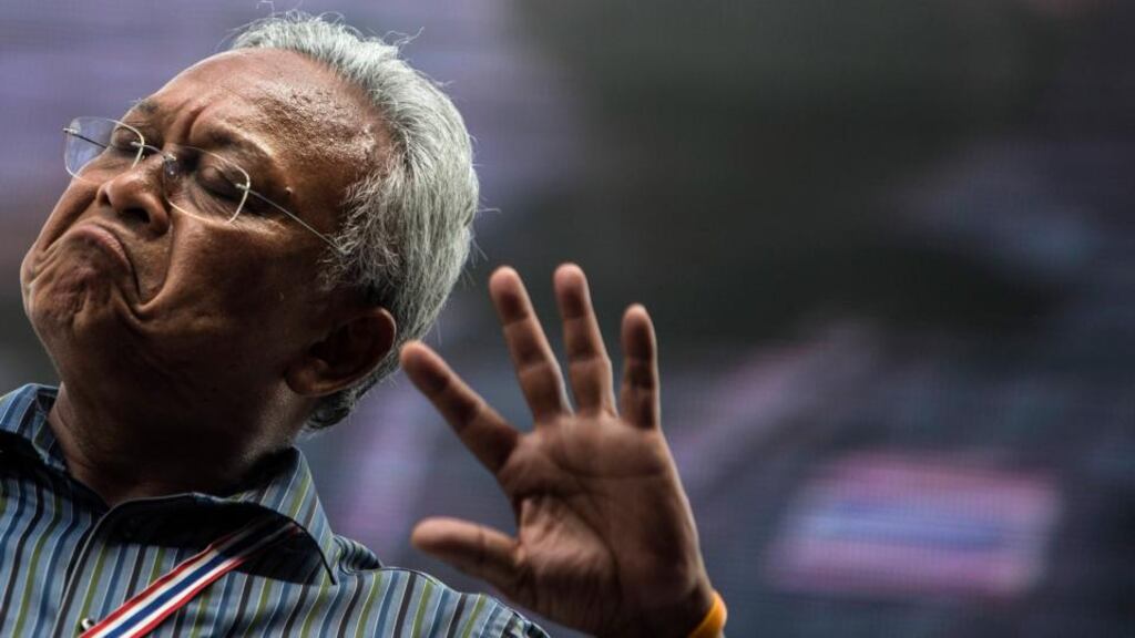 Anti-government protest leader Suthep Thaugsuban speaks to his supporters in central Bangkok, Thailand. Photograph: Nir Elias/Reuters