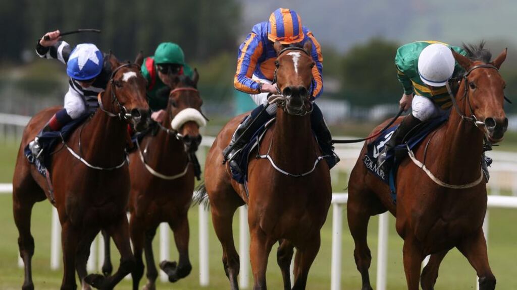 Iveagh Gardens ridden by Niall McCullagh (right) on the way to winning the Canford Cliffs European Breeders Fund Athasi Stakes at Curragh Racecourse, Co Kildare, Ireland. PRESS ASSOCIATION Photo. Picture date: Monday May 4, 2015. See PA story RACING Curragh. Photo credit should read: Brian Lawless/PA Wire