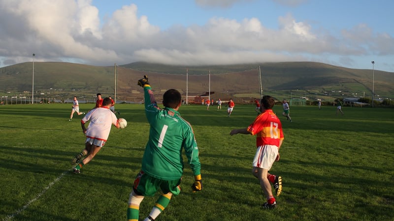 Sneem take on Valentia on the island’s GAA pitch. Valentia has had to merge with Portmagee, Derrynane and Sneem – some 30km away – to field an underage team. Photograph by Paul Carroll, from his book ‘Gaelic Fields’