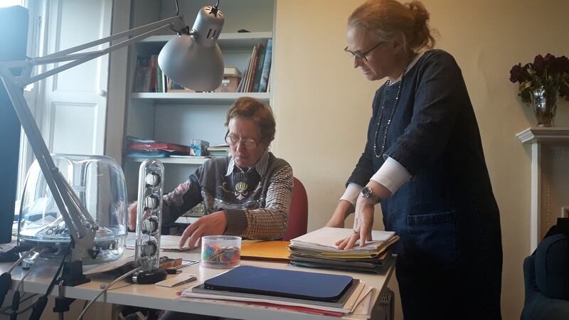 Jane O’Flynn reviewing Liam’s catalogue with ITMA archivist, Maeve Gebruers.