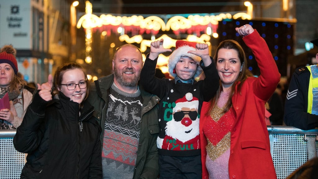 Vicky Phelan with her husband Jim, daughter  Amelia and son Darragh, after turning on the Christmas lights in Limerick on Sunday. Photograph: Sean Curtin True Media