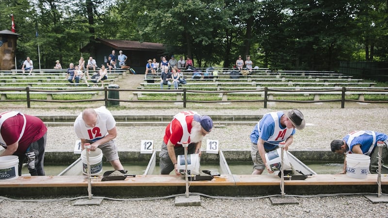 Goldpanners compete in the 36th Italian Gold Panning Championship at the Victimula Gold Panner’s Arena in the Bessa Natural Reserve in Zubiena, Italy. Photograph: Gianni Cipriano/The New York Times