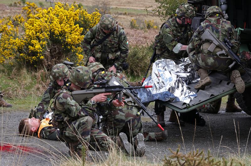 Medics tend to 'casualties' during a pre-deployment Mission Readiness Exercise of the 126th Infantry Battalion. Photograph: Colin Keegan/Collins Dublin.
