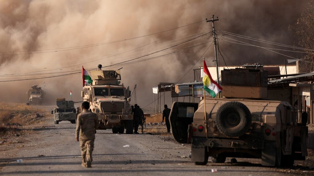 Smoke rises during clashes between Peshmerga forces and Islamic State militants in the town of Bashiqa, east of Mosul, in Iraq. Photograph: Azad Lashkari/Reuters