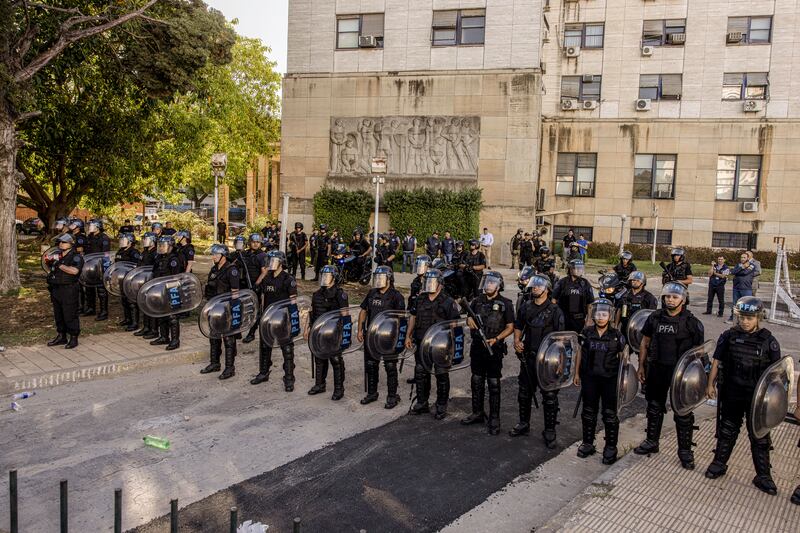 Police stand opposite supporters of Cristina Kirchner outside a courthouse in Buenos Aires on Tuesday, Photograph: Sarah Pabst/The New York Times