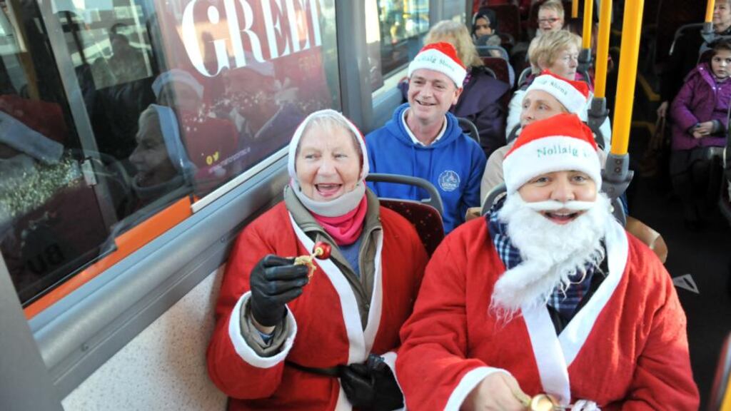 Joan and Aideen Goggin with passengers on a Cork bus demanding that a tradition of bus drivers dressing as Santa be reinstated. Pic Daragh Mc Sweeney/Provision