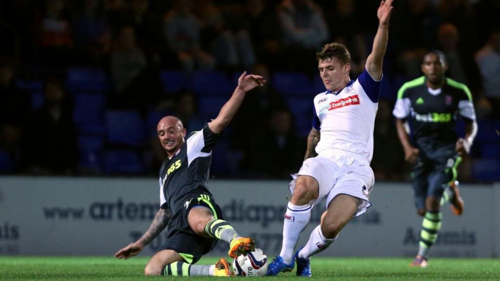 Tranmere Rovers’ Max Power (centre) and Stoke City’s Stephen Ireland during the League Cup, third round match at Prenton Park, Tranmere. Photograph: Peter Byrne/PA Wire